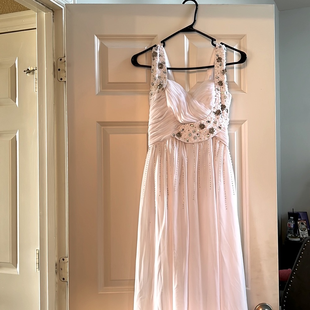 White gown, with sequence work, size 0, like new, worn once, adjustable straps.